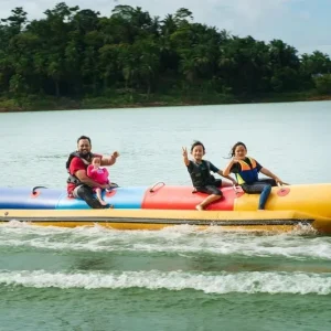 family enjoying banana ride at malvan