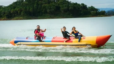 family enjoying banana ride at malvan