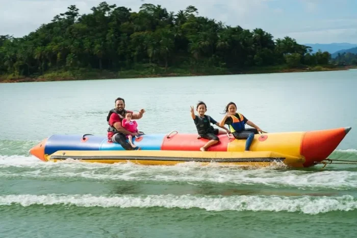 family enjoying banana ride at malvan